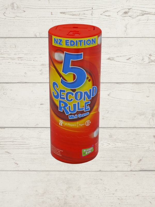 mini version of the 5 Second Rule game displayed with a red cylindrical timer, yellow spiral timer, and several question cards laid out on a wooden surface.