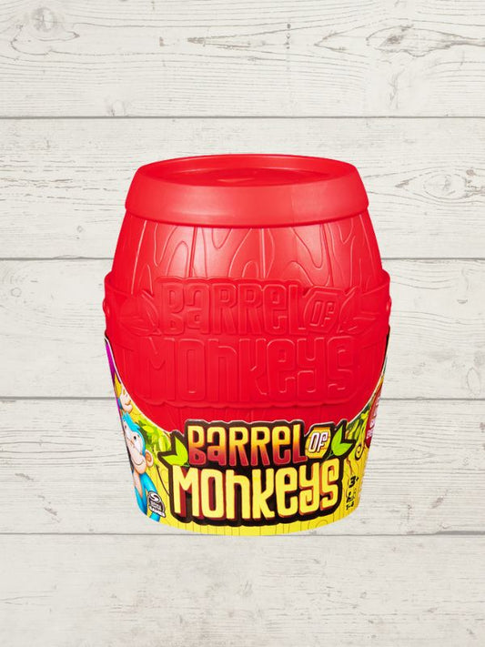 a red barrel with the words 'Barrel of Monkeys' with some cartoon monkeys on it on a wooden background
