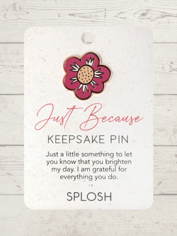 A keepsake pin with a floral design and a quote that reads 'Just because I love you' on a white card with the brand name 'Splosh' at the bottom.