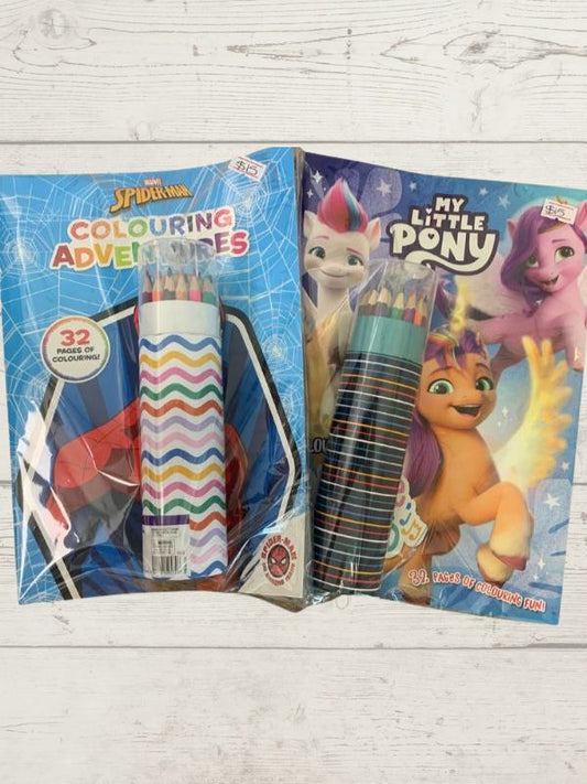 colouring in books with colouring pencils with my little pony and spiderman on a wooden background