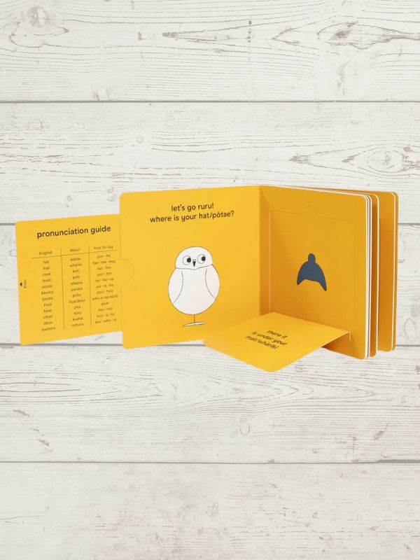 A lift-the-flap board book titled 'Let's Go Ruru' with a bright yellow cover featuring an illustration of a cartoon Ruru (a native NZ bird)