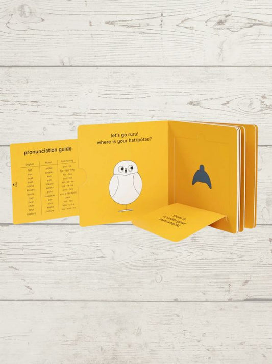 A lift-the-flap board book titled 'Let's Go Ruru' with a bright yellow cover featuring an illustration of a cartoon Ruru (a native NZ bird)