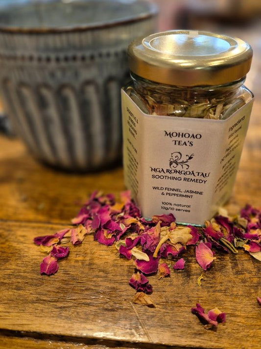 Jar of Mohoao Tea's Nga Rongoatu on a wooden surface with dried flowers.