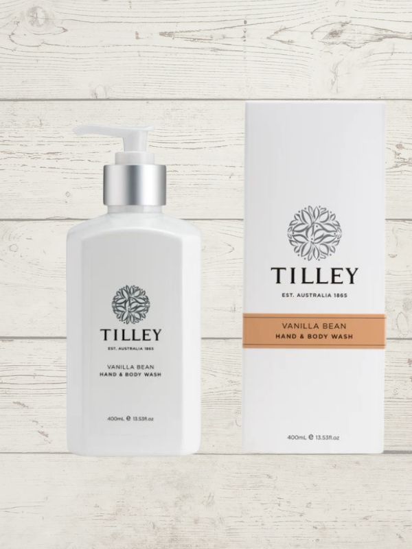 A collection of Tilley body wash bottles in various scents, including lavender, vanilla, and patchouli, with packaging that displays the scent name and minimalist design.