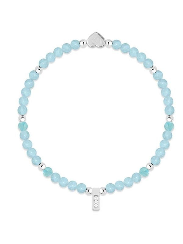Turquoise beaded bracelet with silver heart clasp on a white background