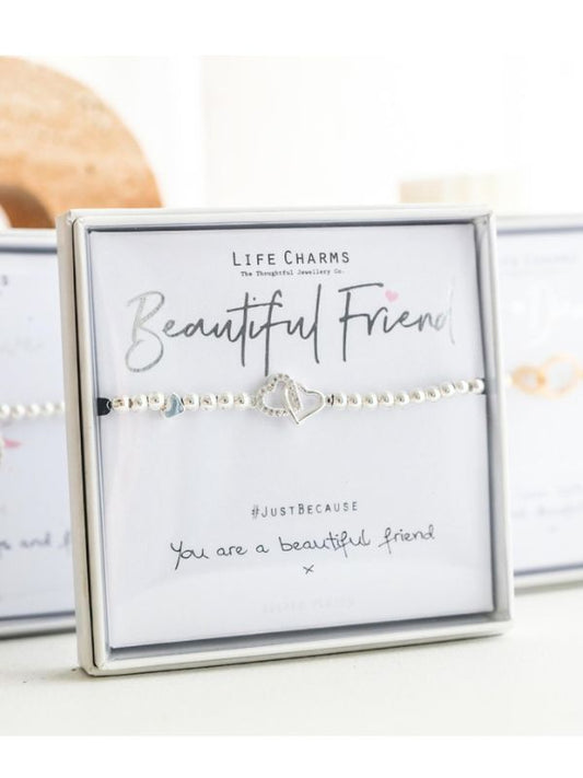 Bracelet with heart charm on a card labeled 'Beautiful Friend' by Life Charms.