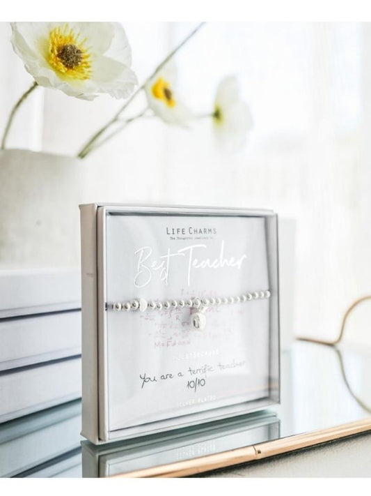 Jewelry set in a box with flowers in the background