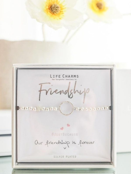 Bracelet on a card with 'Life Charms' branding and 'Friendship' text, featuring silver plating.