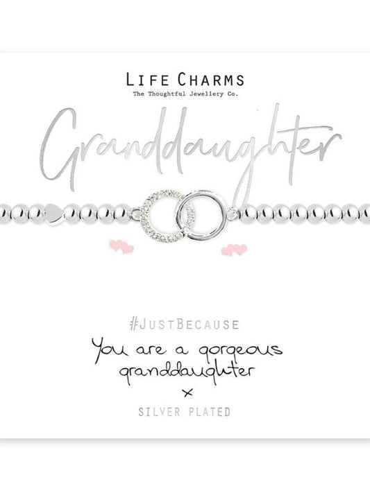 Silver bracelet with heart charm on a white background, featuring 'Life Charms' branding.