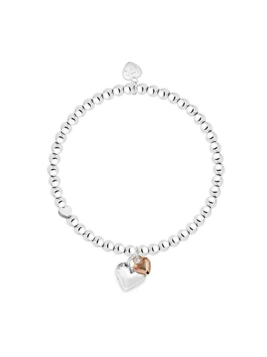Silver bracelet with heart-shaped charms on a white background