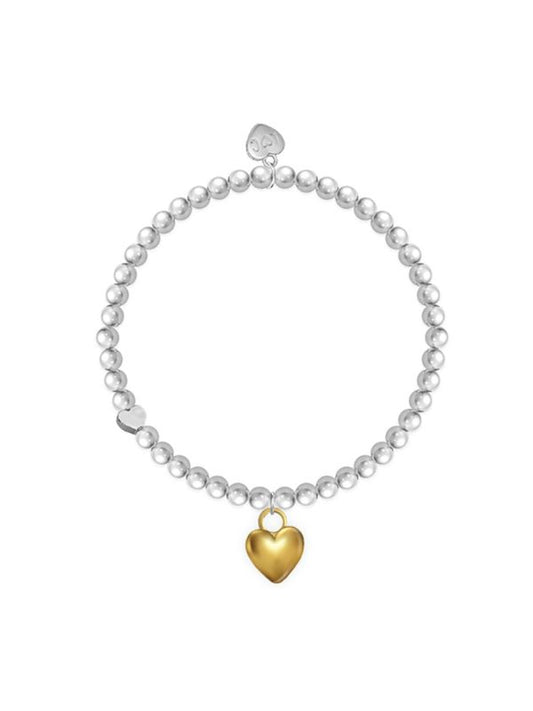 Pearl bracelet with a gold heart charm on a white background