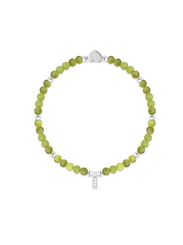 Green beaded bracelet with a silver clasp on a white background