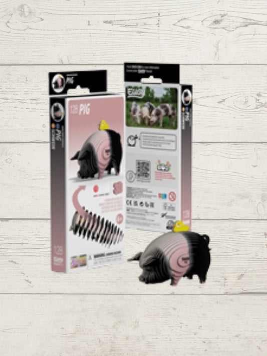 3d puzzle pig with packaging on a wooden surface