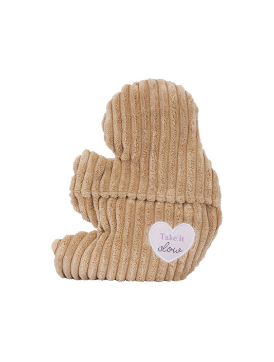 Beige knitted sloth-shaped toy with a heart label on a white background