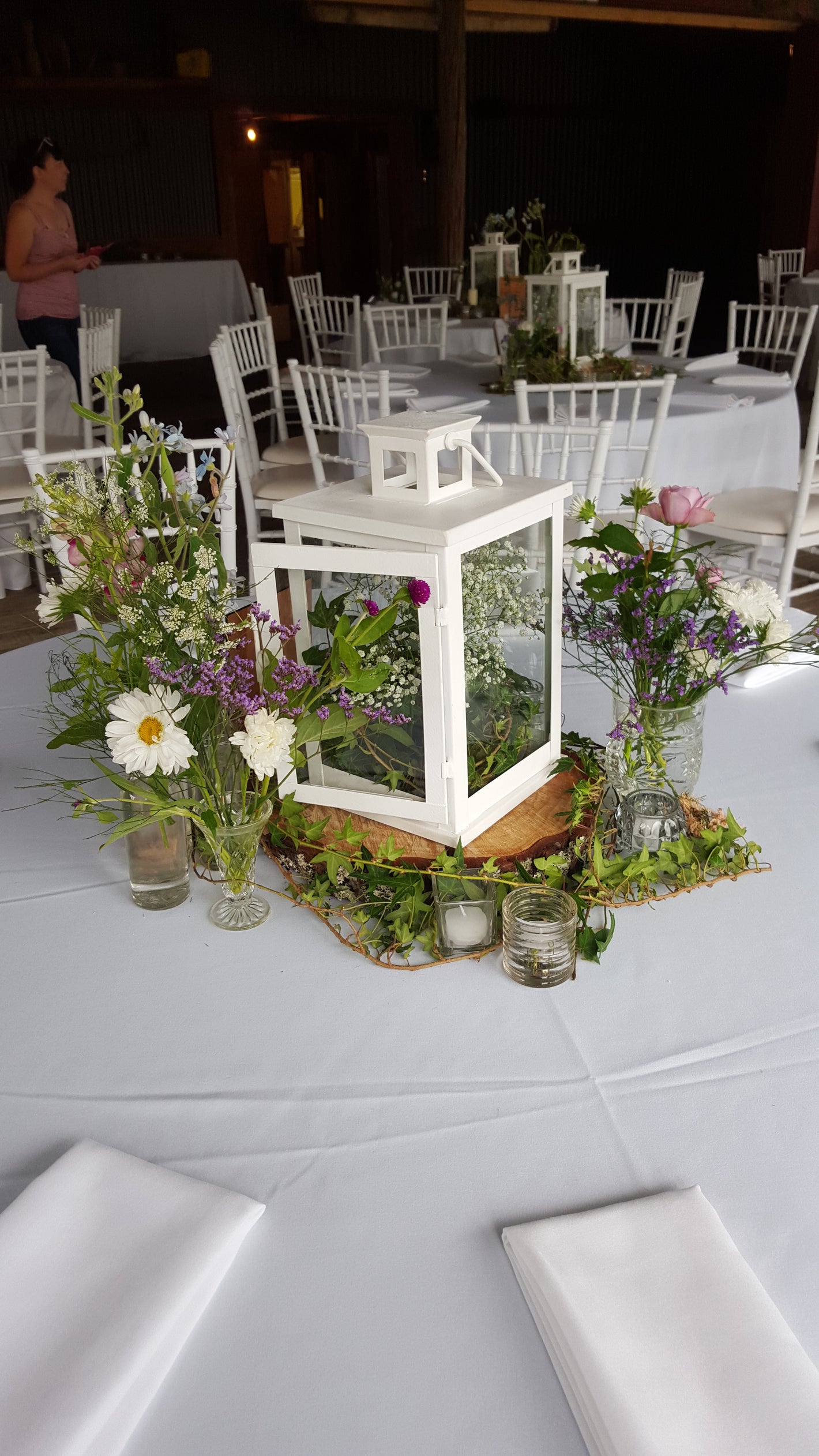 Decorative table with flowers and chairs in a room setting