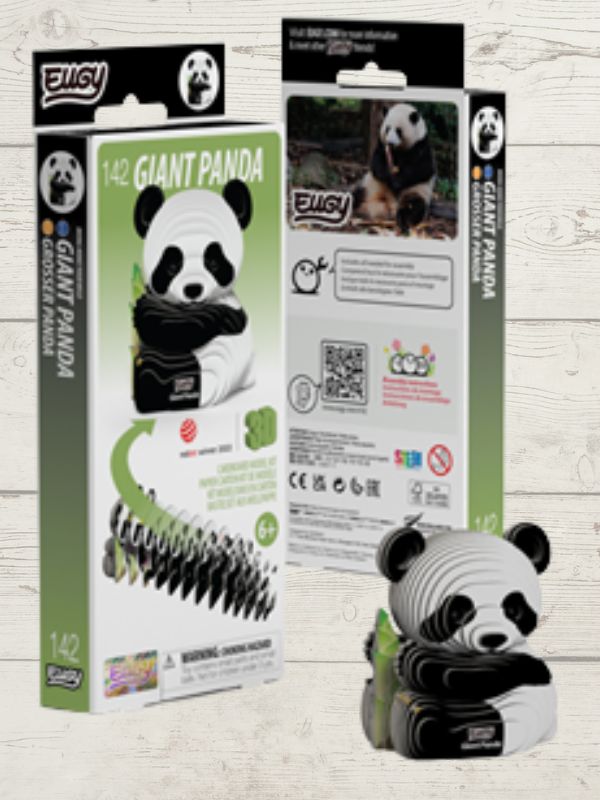 Giant Panda toy with packaging on a wooden surface