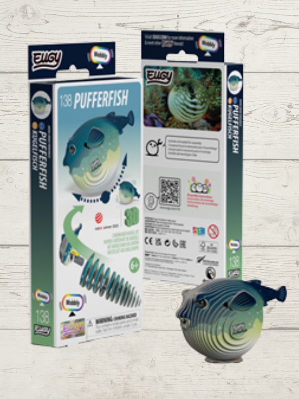 Elgo pufferfish toy with packaging on a wooden surface