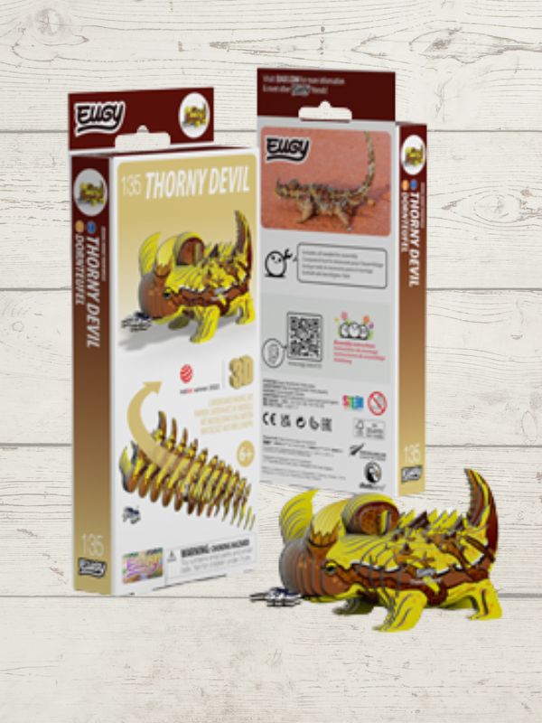 Thorny Devil 3D Puzzle model with packaging on a wooden background