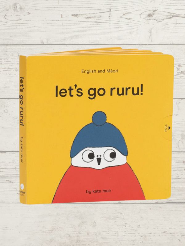 A lift-the-flap board book titled 'Let's Go Ruru' with a bright yellow cover featuring an illustration of a cartoon Ruru (a native NZ bird) wearing a blue hat and a red jumper.