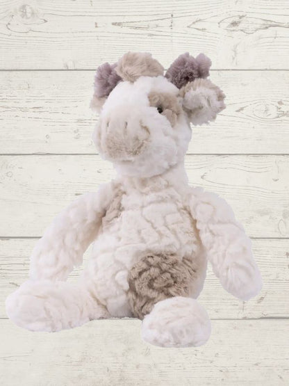 A plush toy resembling a giraffe with white fur, featuring embroidered eyes and a soft texture.