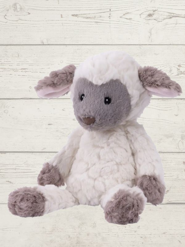 A plush toy resembling a lamb with grey and white fur, featuring embroidered eyes and a soft texture.