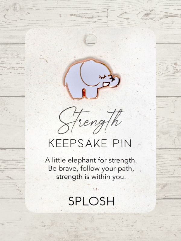 A keepsake pin with a white elephant design, labeled 'Strength', on a card with the brand name 'SPLOSH'.