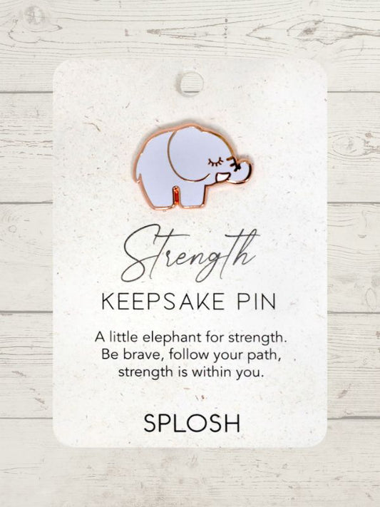 A keepsake pin with a white elephant design, labeled 'Strength', on a card with the brand name 'SPLOSH'.