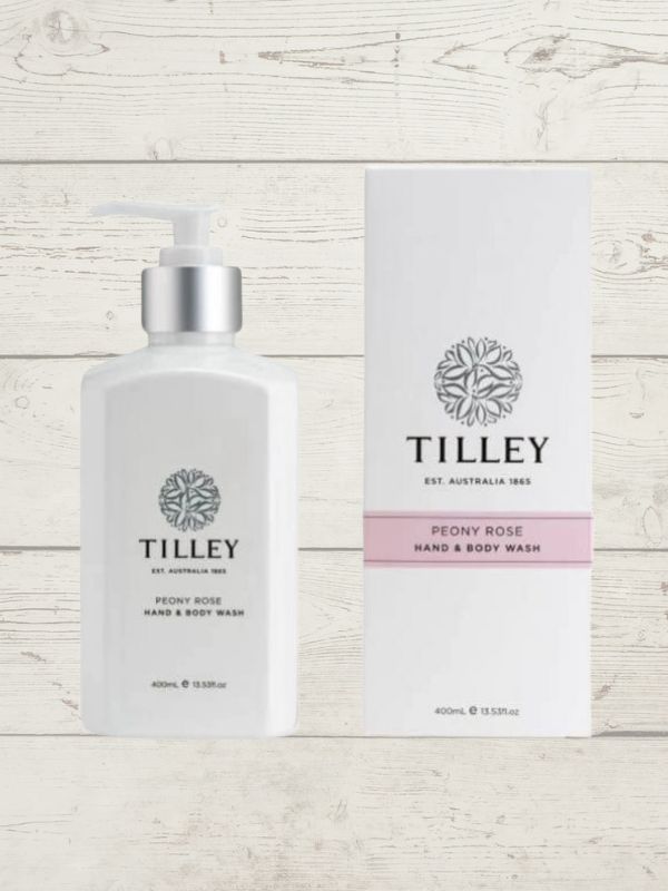 A collection of Tilley body wash bottles in various scents, including lavender, vanilla, and patchouli, with packaging that displays the scent name and minimalist design.