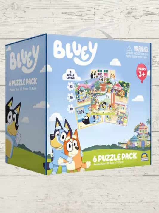 Bluey 6 puzzle pack box on a light wooden surface