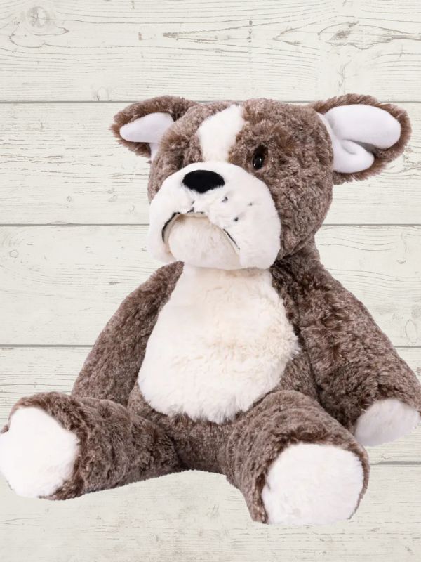 A plush toy resembling a marshmallow bulldog with a brow and white color scheme, featuring embroidered details on the face and a fluffy texture.