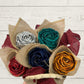 colorful flax flowers wrapped in a kete with a wooden background