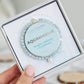 Aquamarine bracelet in a box held by a hand