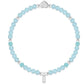 Turquoise beaded bracelet with silver heart clasp on a white background