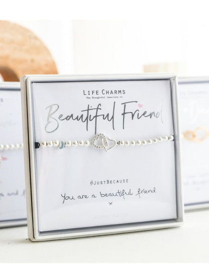 Bracelet with heart charm on a card labeled 'Beautiful Friend' by Life Charms.