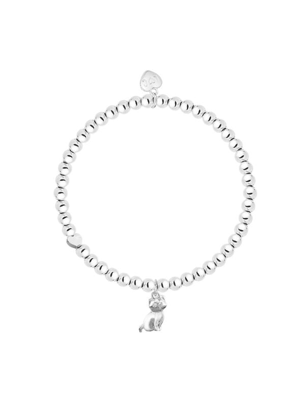 Silver bracelet with a small charm on a white background