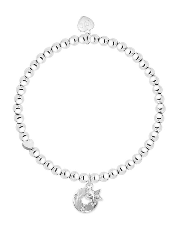 Silver beaded bracelet with moon and star charm on a white background