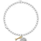 Silver beaded bracelet with a paw print charm on a white background