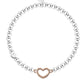 Silver beaded bracelet with a heart-shaped clasp on a white background