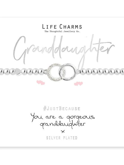 Silver bracelet with heart charm on a white background, featuring 'Life Charms' branding.