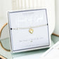 Gold heart bracelet in a 'Life Charms' packaging on a white surface