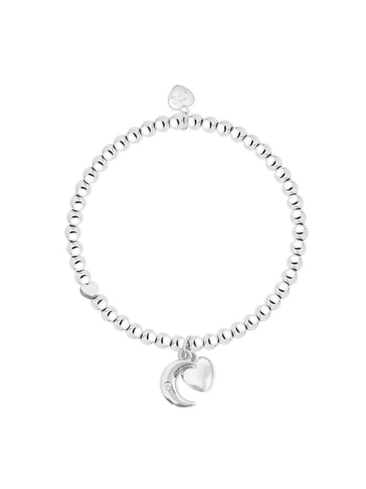 Silver bracelet with a moon charm on a white background