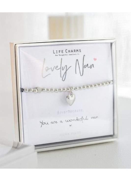 Silver bracelet with heart charm on a 'Life Charms' card