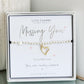 Bracelet with heart charm on a card labeled 'Missing You' by Life Charms.