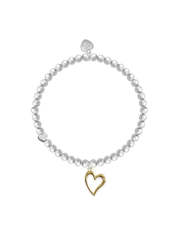 Pearl bracelet with a gold heart charm on a white background