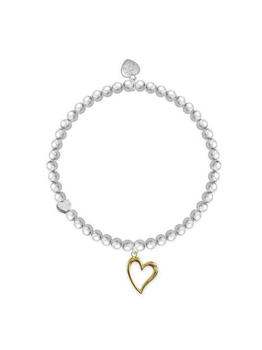 Pearl bracelet with a gold heart charm on a white background