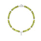 Green beaded bracelet with a silver clasp on a white background
