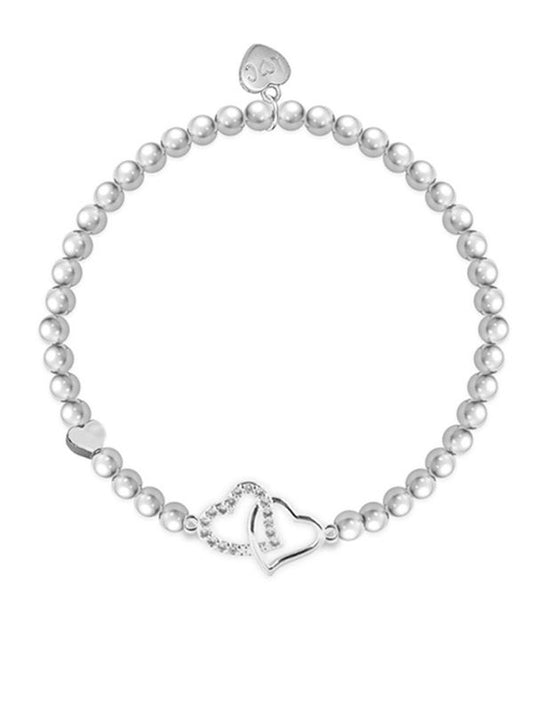 Pearl bracelet with silver heart charms on a white background