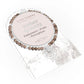 Smoky quartz bracelet with packaging on a white background