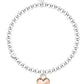 Silver beaded bracelet with a rose gold heart charm on a white background