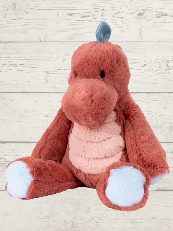 A plush toy resembling a marshmallow dinosaur with a red and blue color scheme, featuring embroidered details on the face and a fluffy texture.